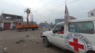 ICRC landcruiser next to electricity pylons in Goma